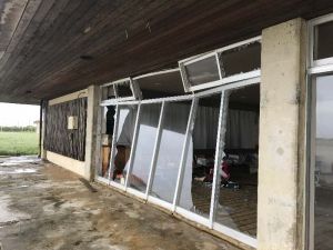 突風で大きく割れた伊江島空港事務所の窓ガラス=16日、伊江村の同所(提供)