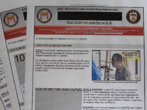 米軍捜査当局による抗議行動の日報。情報公開を求めたジョン・ミッチェル本紙特約通信員の写真もテレビニュースから転用されている